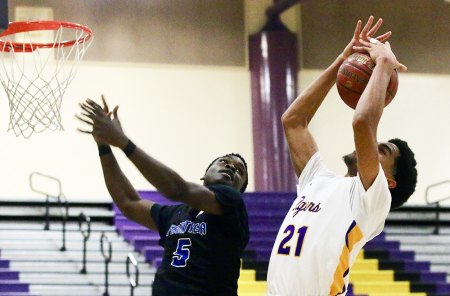 Kaleb Goudeau grabs a rebound from Frontier's Ndifor Ginyui in the second quarter.